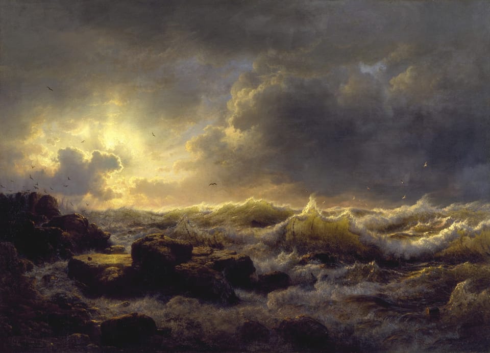 Crashing waves of white and gold. Lapping up onto a rocky shore. Depiciting the glory of Gods beautiful creation.